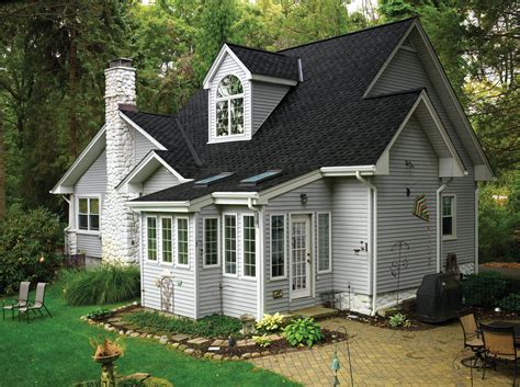 gray house with metal roof|gray homes with black roofs.